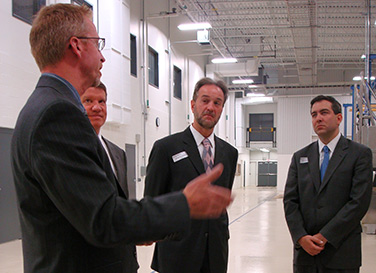 Messier-Bugatti USA CEO Patrick Haywood (left) leads Invest in America Week attendees (L-R Steve Pendery, Gary Moore, David Bohigian), on a tour of the company’s new wheel and brake manufacturing facility.